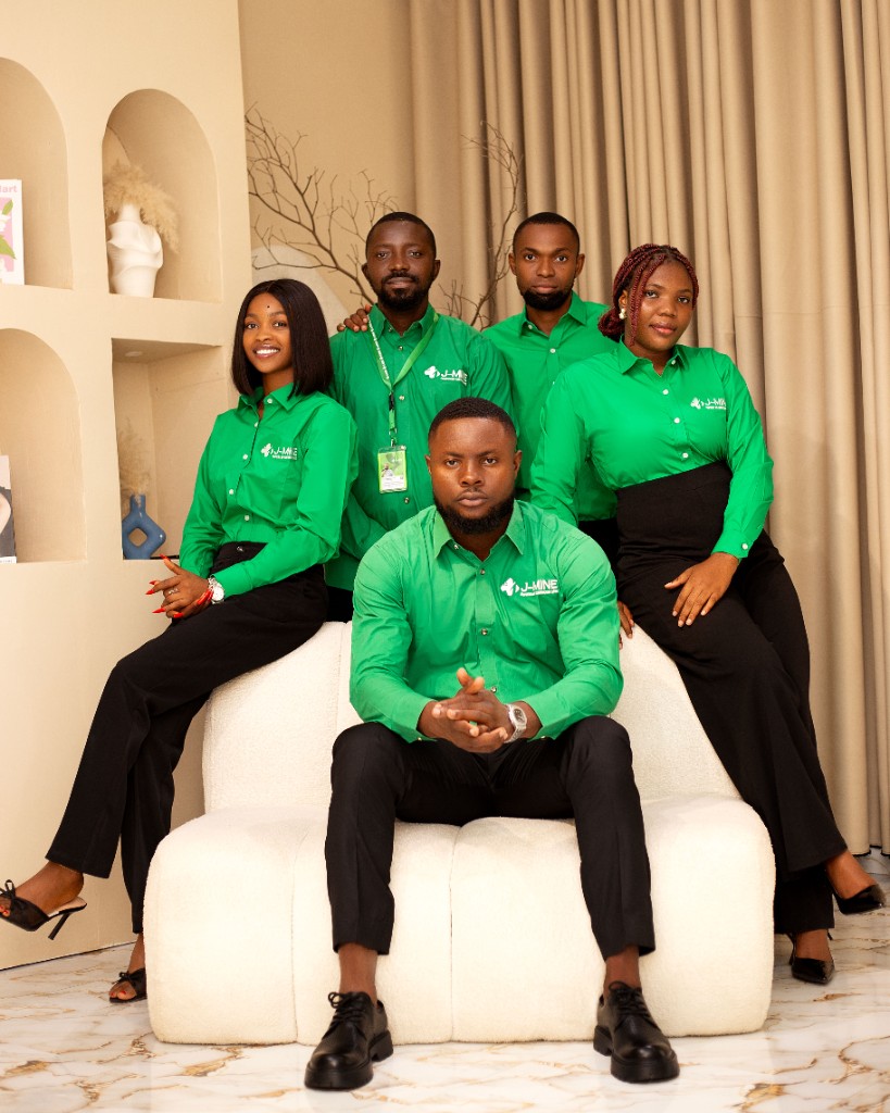 J-MINE colleagues in green office shirts